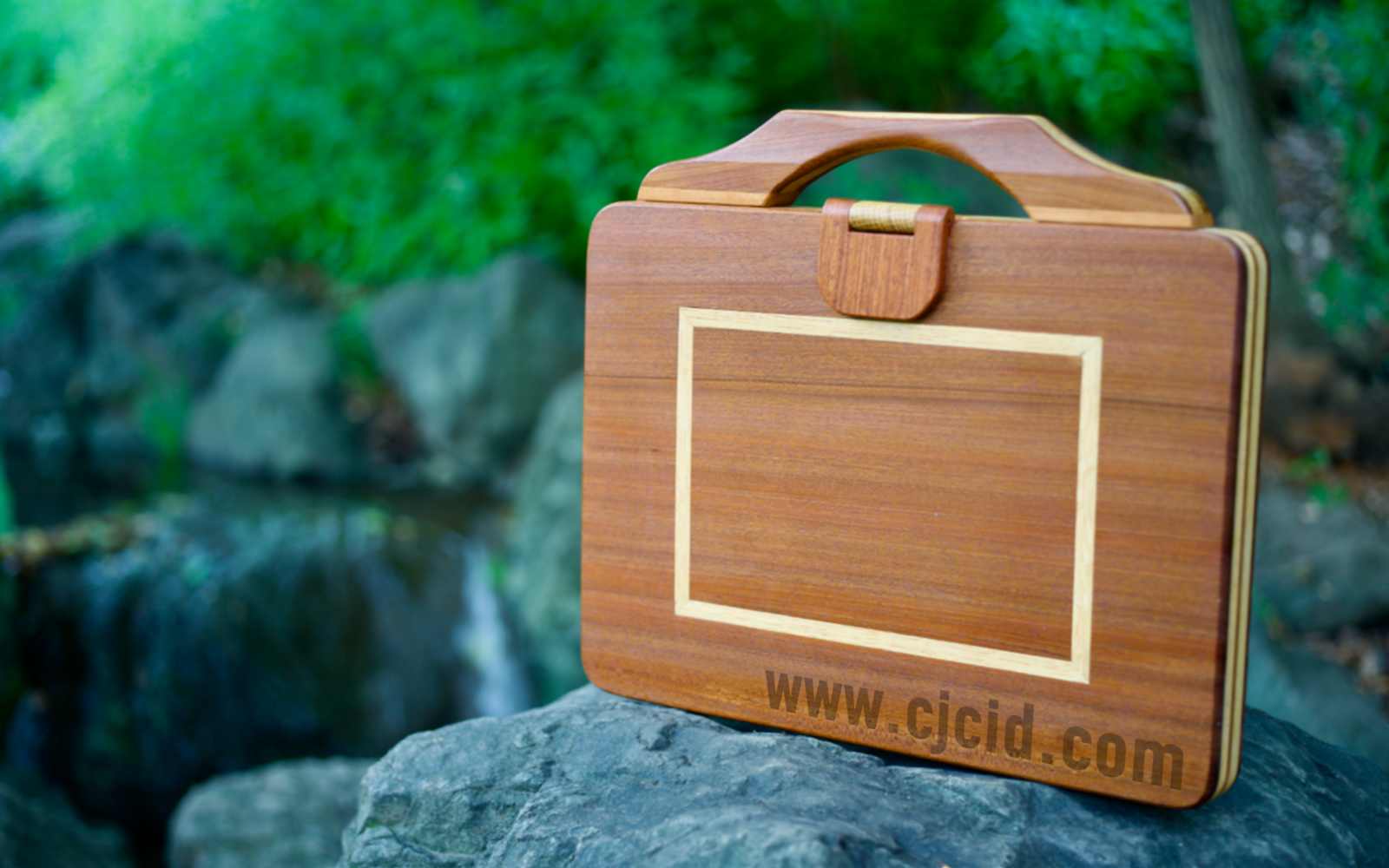 Front view of the handcrafted solid wood attaché case for the 15″ Apple MacBook Pro